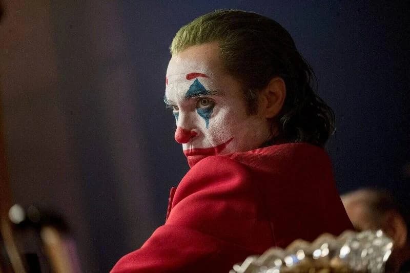 Joaquin Phoenix staring intensely as Arthur Fleck in Joker