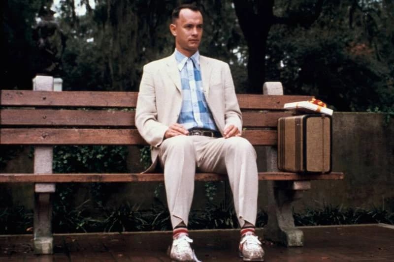 Tom Hanks sitting on bench as Forrest Gump